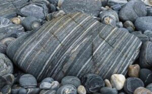 Metamorphic rocks are pre-existing rocks that have changed form deep inside the Earth through intense heat, pressure, or chemically active fluids without actually melting.