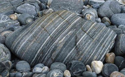 Metamorphic rocks are pre-existing rocks that have changed form deep inside the Earth through intense heat, pressure, or chemically active fluids without actually melting.
